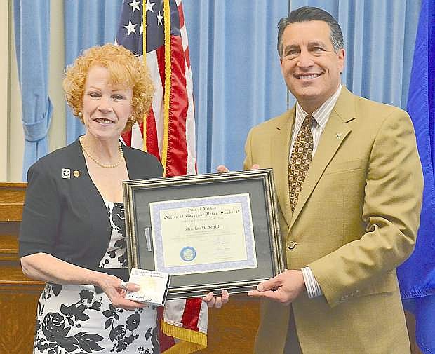 Sharlee Smith has been recognized as Nevada&#039;s April Veteran of the Month. Gov. Brian Sandoval presented her with a certificatre.