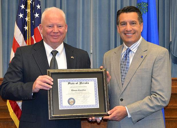 Gov. Brian Sandoval, right, presents Tom Considine with a certificate for November Veteran of the Month.