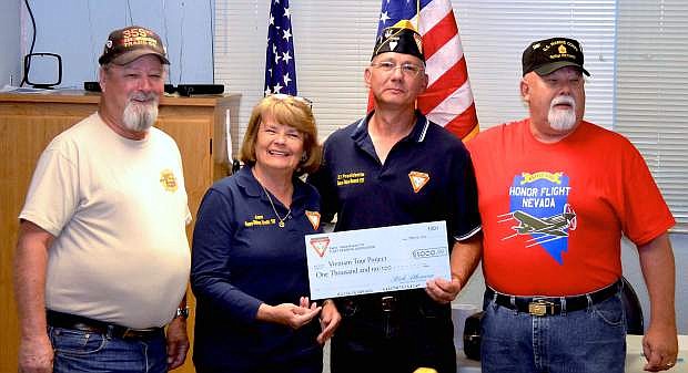 The Fleet Reserve Association Branch 137 and Ladies Auxiliary donated $1,000 to the Vietnam Veterans Association towards their Vietnam Project Honor Flight. Left to right: Tom Spencer of Honor Flight, Jan Solberg president of the Ladies Auxillary;  Rick Athenour, president of FRA and Frank Reynolds, chairman of Vietnam Tour Project.