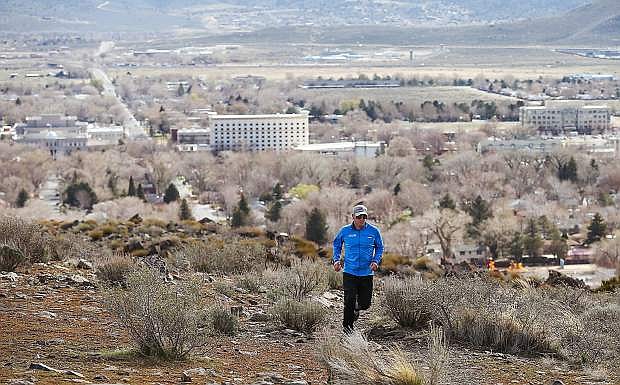 Kevin Bigley runs on C Hill in Carson City, Nev., on Thursday, March 10, 2016. Bigley, owner of Ascent Physical Therapy, organizes a series of trail races throughout the winter.