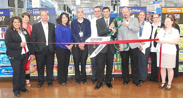 Walmart recently participated in a Fallon Chamber of Commerce ribbon cutting to celebrate its remodeling. From left are Roberta White, Chamber Executive Director Natalie Parrish, Jeremy Dickinson, Jodi Fitzsmorris, Kenny Roseman, Vanc Alm, Store Manager Mounir Benjilali, Marketing Manager Bruce Barlow, Chilane Bolt, Kim Money, Cynthia Mcbeth and Melinda English.