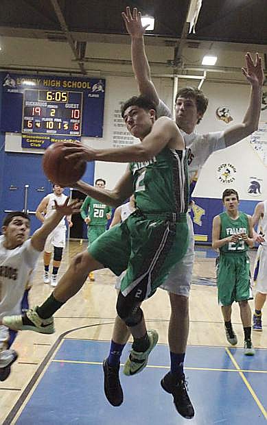 Fallon&#039;s Connor Richardson, ball carrier, attempts a shot from under the net against Lowry&#039;s post players.