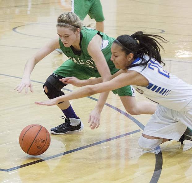 Fallon&#039;s Kaitlyn Hunter battles with Reed&#039;s Larsa Guzman for the loose ball in the second half.
