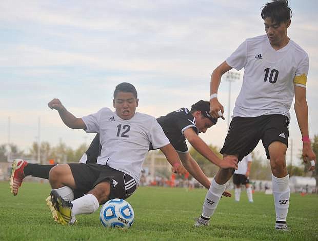 The Greenwave&#039;s Angel Cornejo (12) and Mario Uglade (10) go after the ball in Fallon&#039;s last home match.