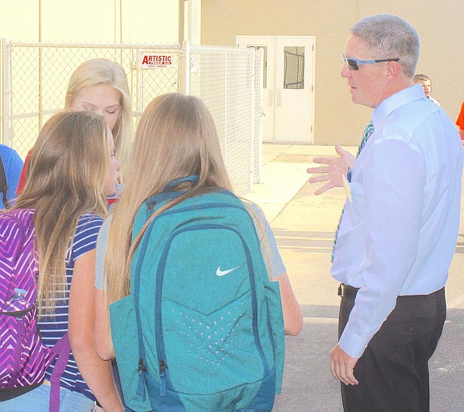 Robert Wickware, vice principal, talks with students at Churchill County Middle School.