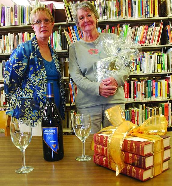 Library director Carol Lloyd, left, and Ann Rapp, are preparing for Saturday&#039;s annual wine tasting fundraiser at the Churchill County Library.