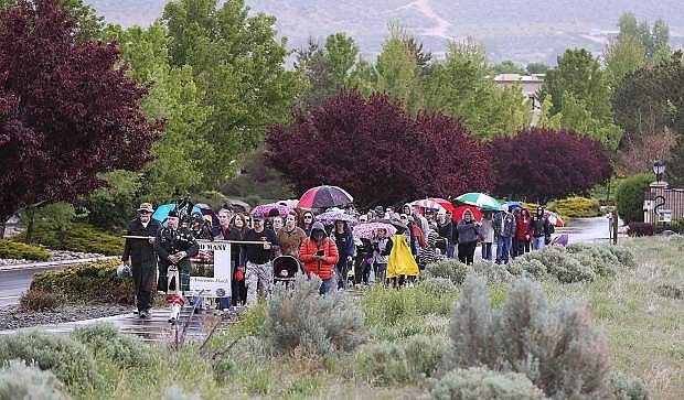 More than 120 people participate in the Western Nevada College 2nd annual Suicide Awareness March in Carson City, Nev. on Saturday, May 7, 2016. The event raises awareness about the average 22 veteran suicides each day in the U.S. and the local services available to help.