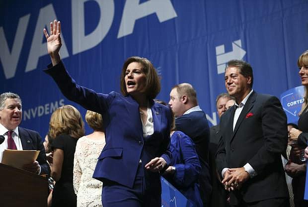 Sen.-elect Catherine Cortez Masto, D-Nev., waves to supporters after her victory at an election watch party in Las Vegas, Wednesday, Nov. 9, 2016. (AP Photo/Chase Stevens)