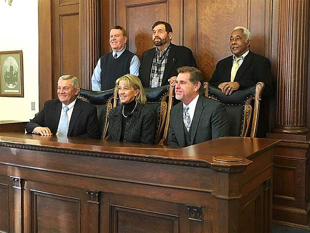 Justices of the Nevada Supreme Court pose with Secretary of State Barbara Cegavske in the old Supreme Court room at the Capitol after canvassing the General Election vote, making the results official on Tuesday.