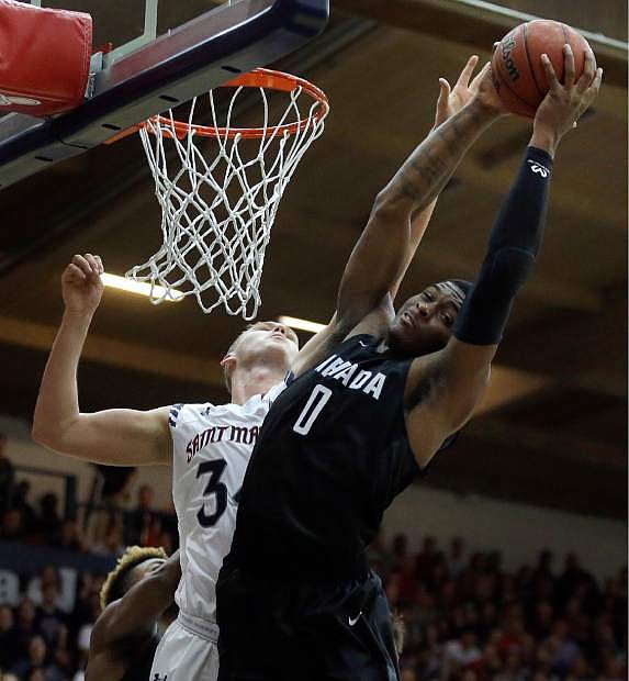 Nevada&#039;s Cameron Oliver (0) rebounds over Saint Mary&#039;s Jock Landale during the first half of an NCAA college basketball game Friday, Nov. 11, 2016, in Moraga, Calif. (AP Photo/Ben Margot)