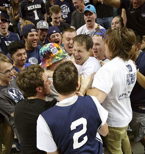 Eric Mussleman celebrates with fans after Nevada beat Morehead State for the College Basketball Invitational last season at Lawlor Events Center.