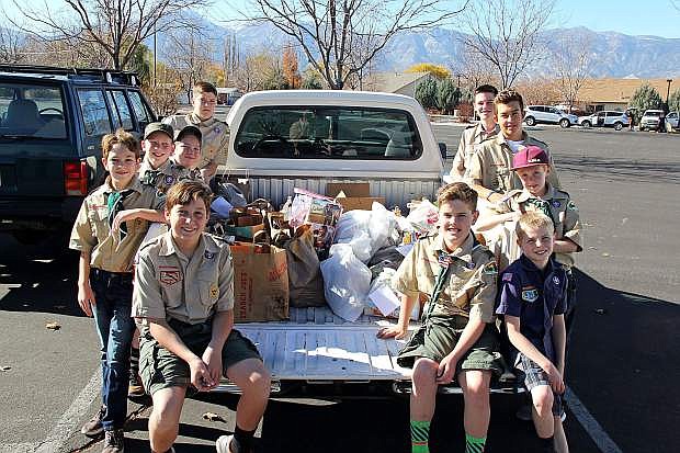 Local Boy Scouts proudly display some of the food collected for local food banks.