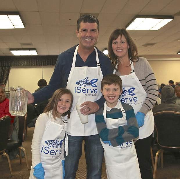 Carson Nugget CEO Dean DiLullo, his wife Traci and kids Kylie, 7, and Cameron, 8, were onhand to help out at the 59th annual Thanksgiving dinner Thursday.