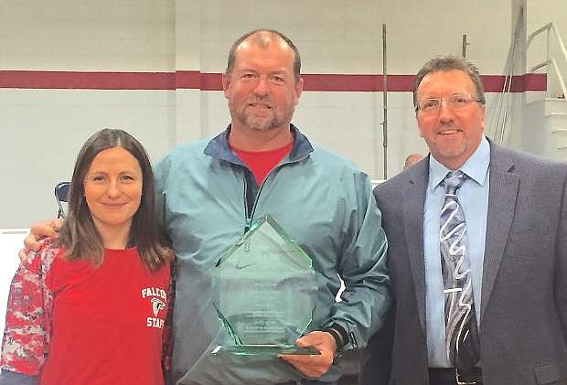 Rob Jacobson, center, with his Administrator of the Year Award from the Nevada Association of School Boards poses with Lyon County School District board member Bridget Peterson, left, and LCSD Deputy Superintendent Alan Reeder.