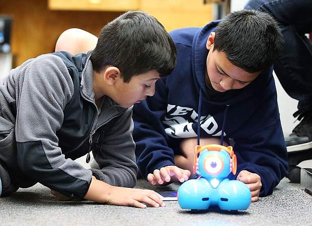 Tristan Perez, left, and David Stoffer, both 11, learn coding skills with a robot at Fritsch Elementary School in Carson City, Nev. on Tuesday, Nov. 15, 2016.