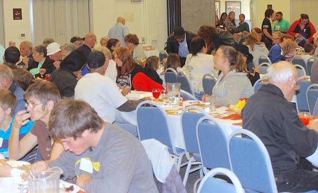 About 900 people from the community enjoy a meal provided by the Christian Life Center.