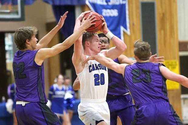 Tez Allen is triple teamed by the Spanish Springs defense on Tuesday night.