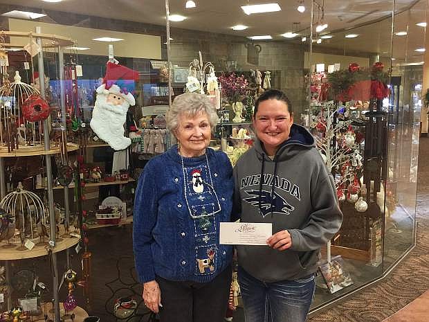 Becca Melino accepts her gift card from Carson Tahoe Auxiliary Gift Shop as part of the Nevada Appeal&#039;s 12 Days of Giving. Go to nevadaappeal.com for your chance to win. The 12 Days of Giving runs through Dec. 23.