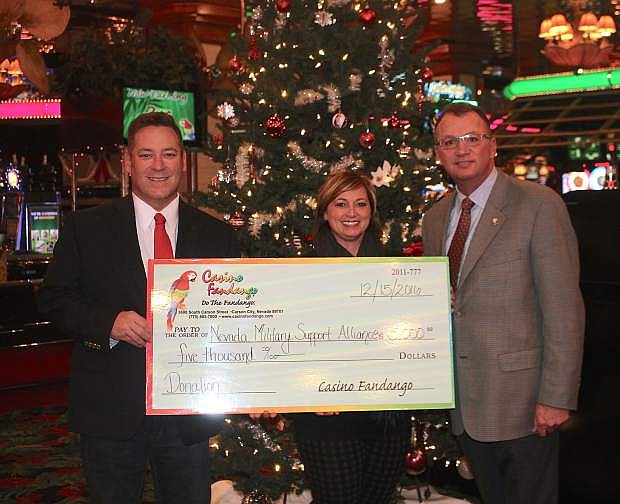Court Cardinal, president of Casino Fandango presents Teresa Di Loreto, Executive Director and Dan Morgan, Director from the Nevada Military Support Alliance with a $5,000 check Thursday. Casino Fandango raised the money during a $10,000 Veteran&#039;s Day promotion in November.