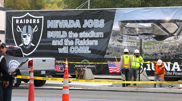 A semi-truck parked across the street from the Legislature Building on Monday displays a banner supporting the construction of a football stadium in Las Vegas.