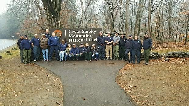 The Sierra Front Incident Management Team in North Carolina is seen before deploying to defend the Qualla Boundary from raging wildland fires. East Fork Fire and Paramedic District Captain Tracy Connelly (second from left), Battalion Chief Scott Fraser (standing, center) and Captain John Brawley (second from right) worked with the team for two weeks in November.