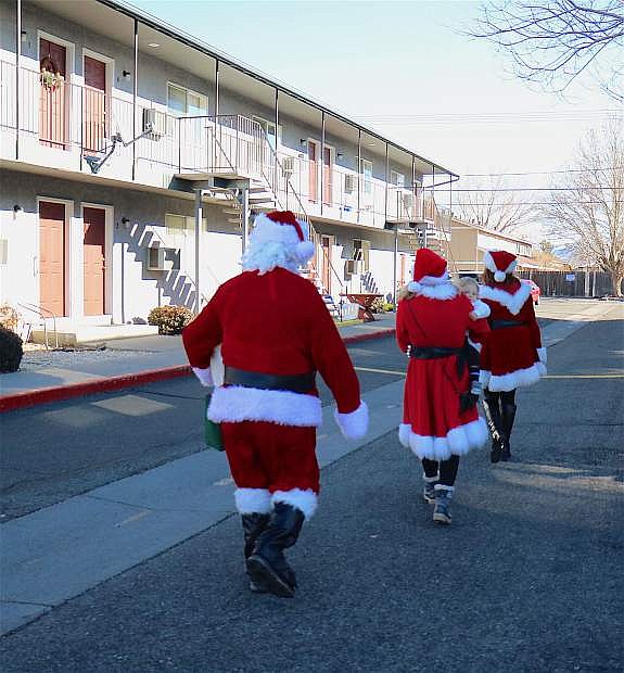 The Pradere family heads over to the apartments of seniors to deliver gifts.