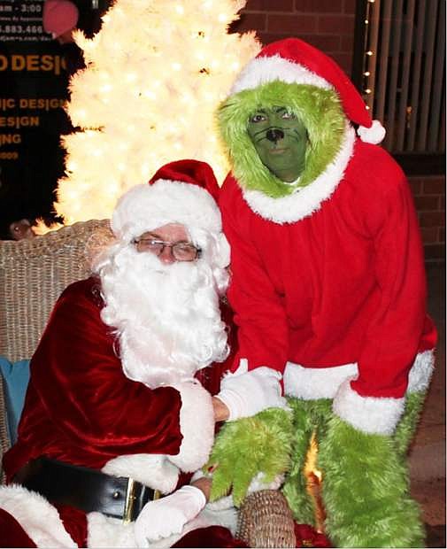 Nick McGahuey as Santa and Kellie George as the Grinch will be appearing at McFadden Plaza today during the annual Silver &amp; Snowflakes Festival of Lights.