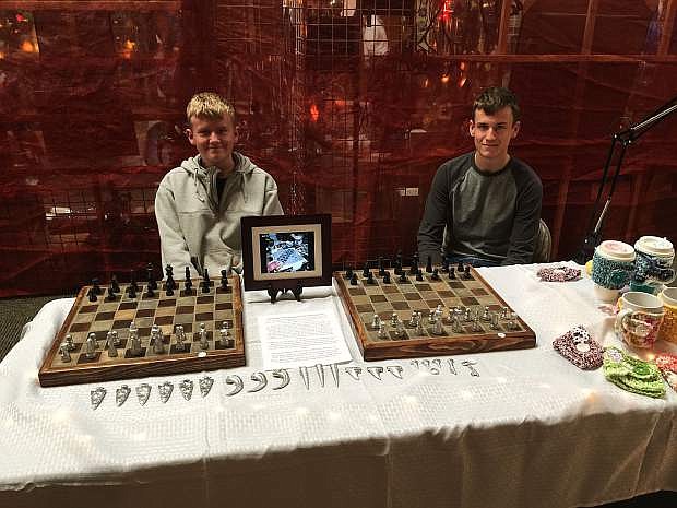 Owen and Garrett Streeter are selling two handcrafted chess sets they made at the holiday craft fair inside the Carson Mall. The fair is open 10 a.m. to 5 p.m. daily through Dec. 24.