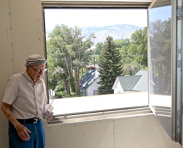 Ormsby House co-owner Don Lehr poses next to a new european style window in one of the 104-suite rooms in 2016.