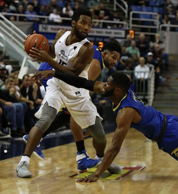 Nevada&#039;s DJ Fenner looks to pass against San Jose State.