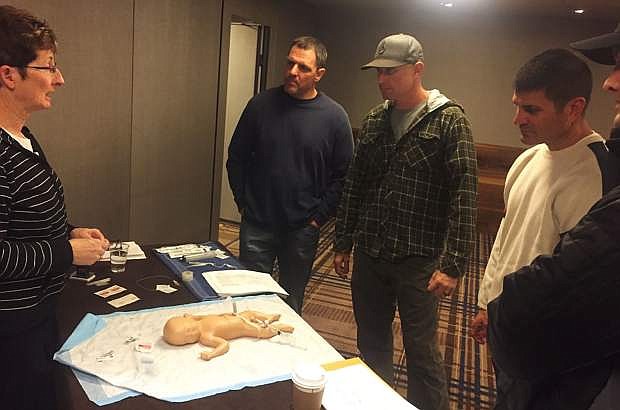 From left: Captain Ron Santos (paramedic), Engineer Dennis Cote (paramedic), Captain Jeff James (paramedic) during a pediatric care simulation.