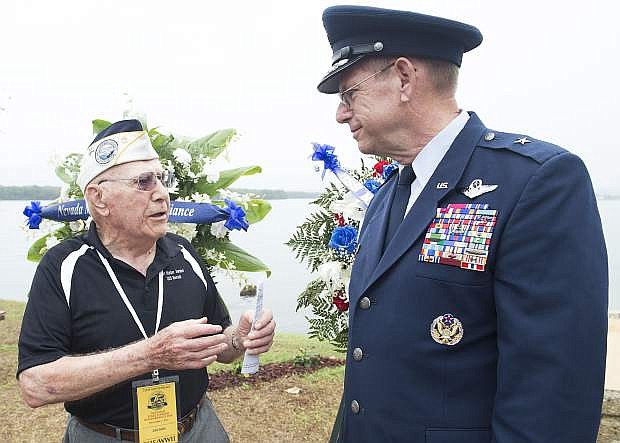 USS Nevada survivor Geb Galle speaks with U.S. Air Force Brig. Gen. William R. Burks, Adjutant General for the State of Nevada, before a commemoration ceremony at the USS Nevada Memorial on Joint Base Pearl Harbor-Hickam. The U.S. military and the State of Hawaii are hosting a series of remembrance events throughout the week to honor the courage and sacrifices of those who served during Dec. 7, 1941, and throughout the Pacific theater.