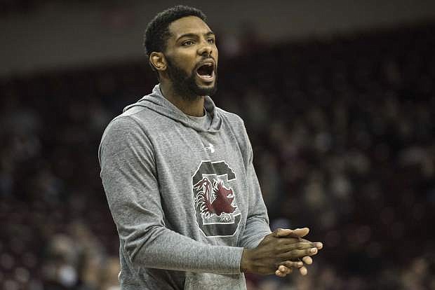 FILE - In this Dec. 4, 2016, file photo, South Carolina guard Sindarius Thornwell cheers on his teammates from the bench during the second half of an NCAA college basketball game against Florida International in Columbia, S.C. South Carolina will be hard pressed to keep up its undefeated start, facing two difficult tasks on the road without suspended leading scorer Sindarius Thornwell. (AP Photo/Sean Rayford, File)