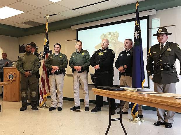 Deputy James Boggan, Sgt. John Hitch, Sgt. Darrin Sloan, Deputy Dan Jones and Deputy Jerrod Adams accept their Medal of Valor and Meritorious Service Medal for their actions during the 2014 Sand Mountain shooting.