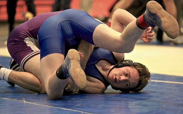 Carson&#039;s Jake Roman is in a spot of bother Friday during a match at the Reno Events Center.