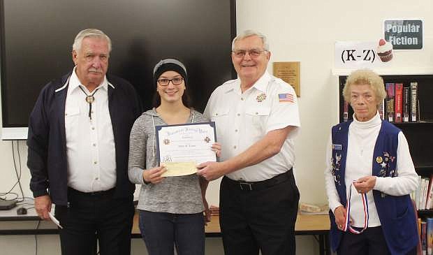 The Veterans of Foreign Wars Post 1002 in Fallon recognizes a Churchill County High School student who placed first locally in the Voice of Democracy essay contest. From left are Dick Hurstak, post commander; CCHS freshman Ashbee Trotter; Mac McLean, senior vice commander; and Donna Bettencourt, president of the VFW Auxiliary.