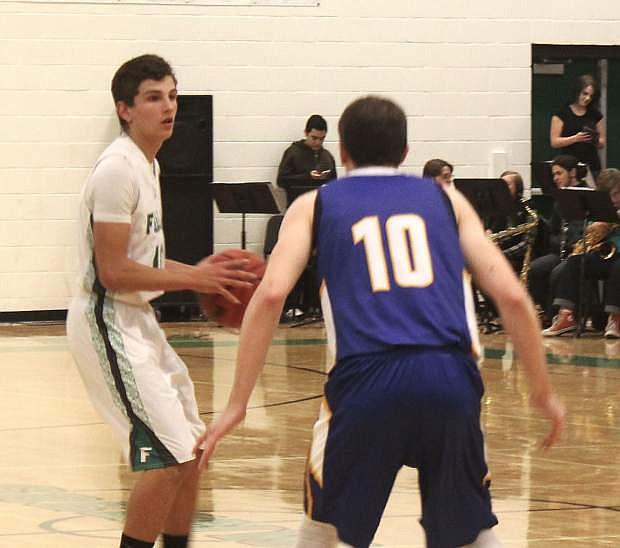 Dalton Kaady looks for an opening through Lowry&#039;s defense during Fallon&#039;s rivalry game against the Buckaroos.