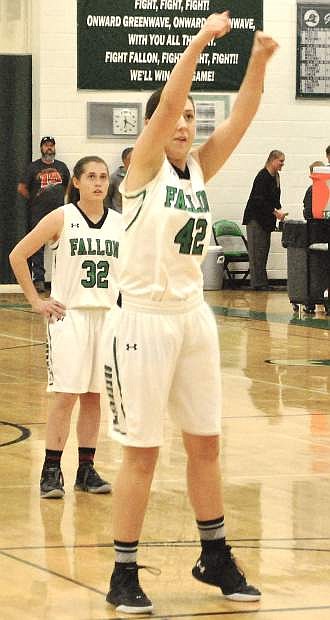 Hannah Evans shoots a basket from the free throw line during Friday&#039;s home game.