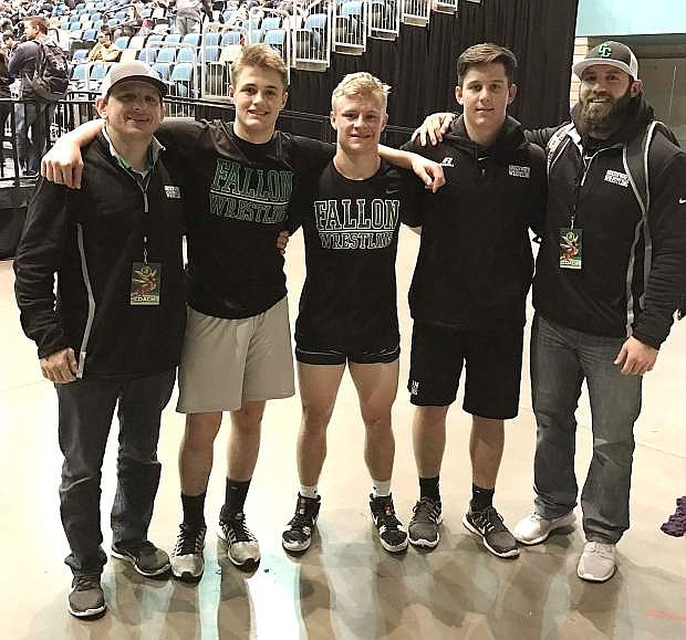Greenwave wrestling assistant coach Dan Shaw, from left, wrestlers Matt Goings, Jack Swisher and Chase Hyde, and head coach Trevor de Braga represent Fallon in the second day of action at the Reno Tournament of Champions over the weekend. The three wrestlers advanced deep in the tournament but didn&#039;t medal.