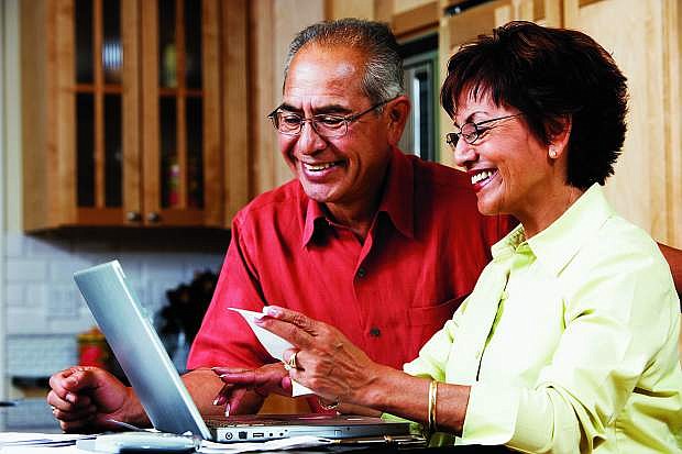 A couple reviews their Medicare plan and its options.