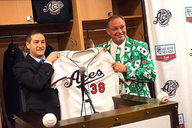 Reno Aces President Eric Edelstein holds us an Aces jersey with new Manager Jerry Narron on Wednesday at Greater Nevada Field.