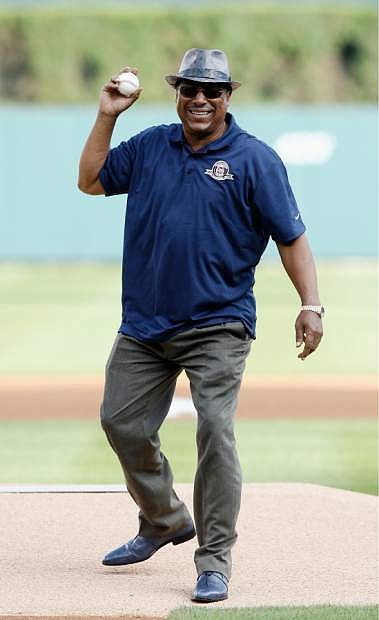 Former Detroit Tigers second baseman Lou Whitaker fakes a throw of a ceremonial first pitch before going to second base and making the toss to former Detroit Tigers shortstop Alan Trammell during a celebration of the Tigers 1984 World Series Championship before a baseball game against the Oakland Athletics, Monday, June 30, 2014, in Detroit. The pair played those positions together for 19 years. (AP Photo/Duane Burleson)