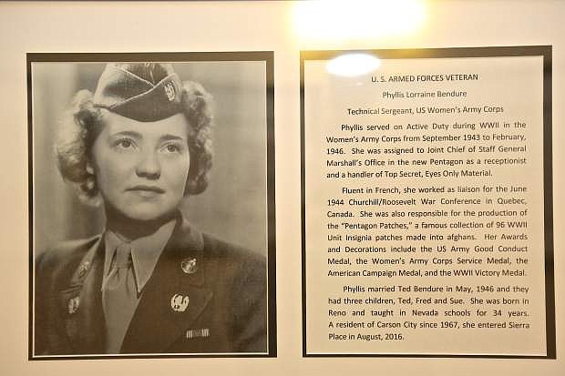 A photo and synopsis of Phyllis L. Anker Bendure&#039;s service life hangs on the wall at Sierra Place Senior Living as seen Friday.