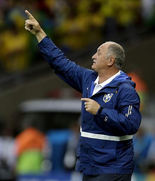 Brazil&#039;s coach Luiz Felipe Scolari gives instructions to his players during the World Cup semifinal soccer match between Brazil and Germany at the Mineirao Stadium in Belo Horizonte, Brazil, Tuesday, July 8, 2014. (AP Photo/Natacha Pisarenko)