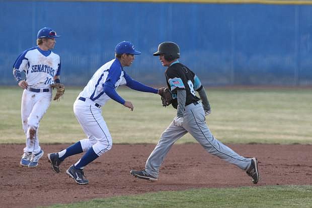 Third baseman Brandon Allen tags out a North Valleys runner on Tuesday.