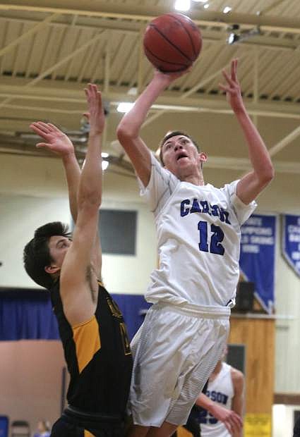 Trenten Robison drives to the basket against Galena on Tuesday night.