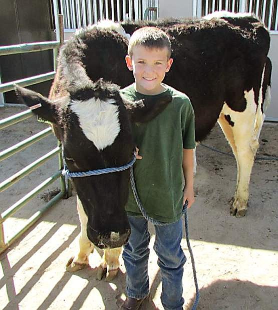 An Arrowhead Livestock 4-H Club member shows his dairy cow at Capital City Farm Days. This year, the event will run from 8:30 a.m. to 2 p.m., April 21 and 22.