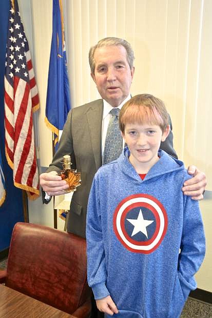 5th grader Carson Hamann presented Mayor Bob Crowell with a bottle of New York maple syrup Thursday at City Hall.