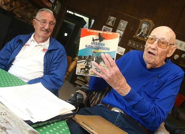 Carson Valley residents Clarence Godecke, 94, right, and Garry Denheyer, 81, talk about Operation Chowhound, a World War II mission to provide food to the people of Holland in May 1945. Godecke was an Air Force pilot who air-dropped aid packages, and Denheyer was a young boy in Holland who found a food package in his backyard from the mission.