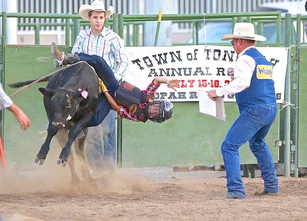 9-year-old Lucas Wold of Carson City is thrown from his calf during competition Friday night at Fuji Park.